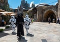 Kylo Ren and two Storm Troopers walking among the tourist at Galaxy`s Edge Royalty Free Stock Photo