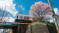 Cherry blossom at Keifuku Electric Railroad Type 101 on Arashiyama Line view from near Shijo-Omiya Royalty Free Stock Photo