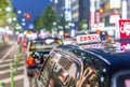 KYOTO, JAPAN - APRIL 2016: Black taxi awaits customers at night.