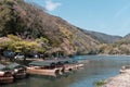 Boats in Katsura River in Arashiyama district with cherry blossom in spring time Royalty Free Stock Photo