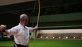 Kyudo practicing bow shooting at night in Kyoto, Japan.