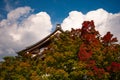 Kyoto, Japan. Autumn maple leaves and temple roof Royalty Free Stock Photo