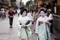 KYOTO,JAPAN- CIRCA MAY, 2016: Maiko geisha walking on a street of Gion in Kyoto Japan Royalty Free Stock Photo