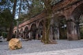 Red brick bridge in Nanzen-ji Temple surrounded by trees and forest