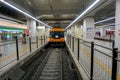Front of Japan subway train parked at destination platform