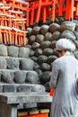 Japanese lady praying at Fushimi Inari Taisha Shrine