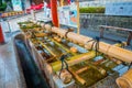 KYOTO, JAPAN - JULY 05, 2017: Close up of hand wash pavilion in Fushimi Inari Shrine in Kyoto Royalty Free Stock Photo