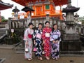 Four women dressed in traditional colorful kimono in a Kyoto temple