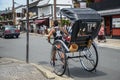 Kyoto, Japan - 24 July 2016. Street in Kyoto on a summer day in July, a man pulling a rickshaw.