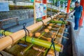 KYOTO, JAPAN - JULY 05, 2017: Unidentified people washing their hands at hand wash pavilion in Fushimi Inari Shrine in Royalty Free Stock Photo