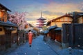 Scenic cityscape of Yasaka pagoda sunset in Kyoto with a young Japanese woman in a traditional Kimono dress Royalty Free Stock Photo
