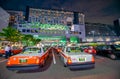 KYOTO, JAPAN - MAY 2016: City taxis and modern buildings along the central train station at night