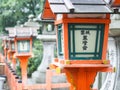 Red japanese lantern posts perspective view with bokeh background. Royalty Free Stock Photo