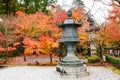 Kyoto, Japan - Nov 25, 2016. beautiful autumn garden with ancient lanterns and color of Japan maple leaves  on tree at the park at Royalty Free Stock Photo