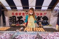 Japanese woman selling takoyaki at shop on the street to Fushimi Inari shrine