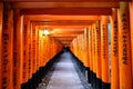Kyoto, Japan - Nov 11 2017 : Pathway with red ancient wood torii gate and japanese letter at Fushimi Inari Royalty Free Stock Photo