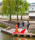 KYOTO, JAPAN - NOVEMBER 7, 2017: Couple in a kimono on the river bank. Copy space for text.
