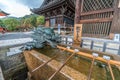 Dragon and Hishaku dippers of Chozuya or Temizuya water ablution pavilion at Kiyomizu-dera Buddhist Temple. Located in HIgashiyama
