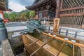 Dragon and Hishaku dippers of Chozuya or Temizuya water ablution pavilion at Kiyomizu-dera Buddhist Temple. Located in HIgashiyama