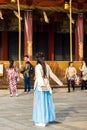 KYOTO, JAPAN - NOVEMBER 7, 2017: Girl in blue dress posing for photographer. Copy space for text. Vertical.