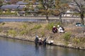 Kyoto, Japan - November 7, 2019: Group of Japanese Professional Male Divers On River for Underwater Construction Works Street of