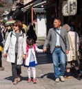 KYOTO, JAPAN - NOVEMBER 7, 2017: Japanese family on a city street.
