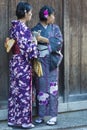 Japanese Ladies Posing in Geisha Kimono and taking Pictures At One of the Kyoto Streets, Japan