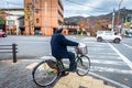 Man on bike at traffic junction in Kyoto Royalty Free Stock Photo