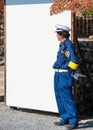 KYOTO, JAPAN - NOVEMBER 7, 2017: Japanese policeman on white banner background. Frame for text. Copy space for text.