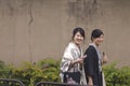 Two Young Japanese Ladies in Traditional Japanese Kimono Walking on Street of Kyoto , Japan