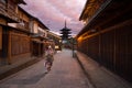 A woman dressed like a Maiko apprentice geisha taking a photo of Yasaka Pagoda of Hokan-ji temple in Gion, Kyoto, Japan Royalty Free Stock Photo