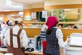 KYOTO, JAPAN - NOVEMBER 7, 2017: Workers at the ticket office at a local cafe. Copy space for text.