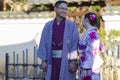 Young Lovely Couple in Geisha Silk Kimono Posing On One of the Kyoto Streets, Japan