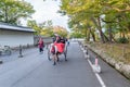 KYOTO, JAPAN - OCTOBER 08, 2015: Rickshaw in Tokyo, Japan. With Local Poople and Shite Park in background