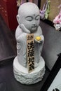 Kyoto - Japan - Stone Jizo statue with a piece of handmade soap