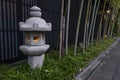 Kyoto, Japan - Traditional stone lantern and bamboo