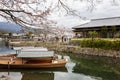 Kyoto, Japan, 04/06/2017: Traditional wooden Japanese boats on the river in a beautiful flowering spring nature. Holiday Hanami Royalty Free Stock Photo