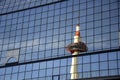 Kyoto Tower mirrored by glass steel of Kyoto railway station Japan