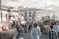 KYRENIA, CYPRUS - MAY 12, 2018: Crowds of people walk along harbor waterfront