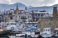 KYRENIA, CYPRUS - WINTER, 2019: Kyrenia seafront. Sea pier with boats, ships and yachts. Historical and tourist place