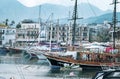 KYRENIA, CYPRUS - WINTER, 2019: Sea pier with boats, ships and yachts. Beautiful Seascape on a background of mountains Royalty Free Stock Photo