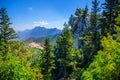 Kyrenia Girne mountain range from medieval Saint Hilarion Castle with green trees and rocks, blue sky Royalty Free Stock Photo