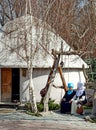 Kyrgyz women in national clothes on a swing near urta