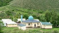 Kyrgyzstan landscape with a local mosque, Osh region Royalty Free Stock Photo