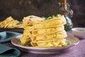 Kystyby - a thin flatbread filled with mashed potatoes and onions on a plate on the table Royalty Free Stock Photo