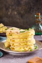 Kystyby - a thin flatbread filled with mashed potatoes and onions on a plate. Vertical view Royalty Free Stock Photo