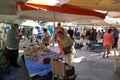 tourists of various nationalities shop in the characteristic market of typical products in Potamos, Greece