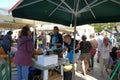 tourists of various nationalities shop in the characteristic market of typical products in Potamos, Greece