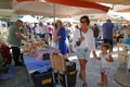 tourists of various nationalities shop in the characteristic market of typical products in Potamos, Greece