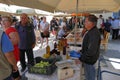 tourists of various nationalities shop in the characteristic market of typical products in Potamos, Greece